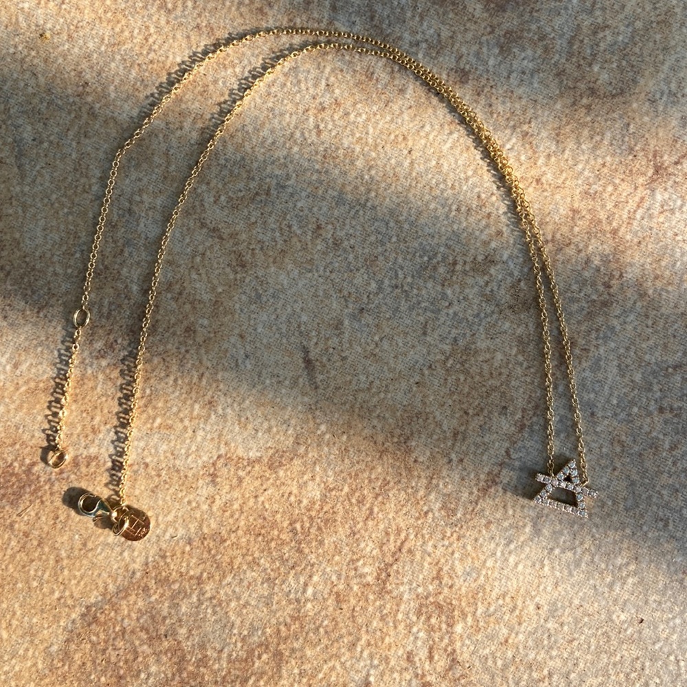 Logan Hollowell diamond air sign necklace
